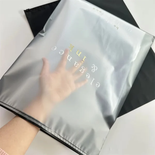 Stacked custom printed packaging bags for clothes in different sizes for apparel brands