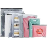 Custom clothing packaging bags featuring frosted material and zipper closure, designed for professional apparel packaging and brand presentation