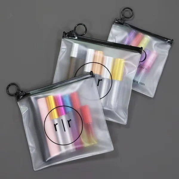 Frosted PVC Make Up Zipper Bag holding makeup tools and bottles with reinforced zipper edge