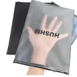 Matte frosted zipper packaging bags for clothes showing semi-transparent finish and brand logo printing