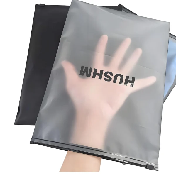 Matte frosted zipper packaging bags for clothes showing semi-transparent finish and brand logo printing
