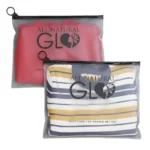 PVC Frosted Zipper Clothing Bag displaying folded garments inside a semi-transparent frosted PVC bag with custom printed logo and zipper closure