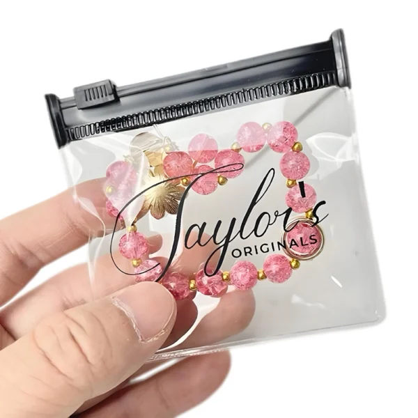 Clear PVC Jewelry Packing Bag featuring a secure zipper closure and printed logo, designed for storing bracelets and small jewelry items